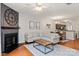 Spacious living area with a fireplace and open to the eat-in kitchen at 1518 Sylvia Ct, Charlotte, NC 28205
