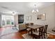 Open floor plan with a fireplace, French doors to the patio, and hardwood floors at 1518 Sylvia Ct, Charlotte, NC 28205