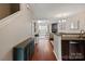 Inviting interior showcases an open-concept design with hardwood floors and decorative fireplace at 1518 Sylvia Ct, Charlotte, NC 28205