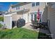 View of the patio, showcasing the grill and outdoor dining set, ideal for enjoying the outdoors at 1518 Sylvia Ct, Charlotte, NC 28205