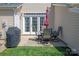 Cozy outdoor patio with dining set and grill, perfect for relaxing or entertaining outdoors at 1518 Sylvia Ct, Charlotte, NC 28205
