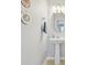 Bathroom featuring a pedestal sink, decorative wall hangings and tile flooring at 15643 Canmore St, Charlotte, NC 28277