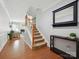 Entry way with hardwood floors and stairs leading to upper level at 15643 Canmore St, Charlotte, NC 28277