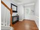 Inviting foyer featuring hardwood floors, fresh neutral paint, and decorative molding at 15643 Canmore St, Charlotte, NC 28277