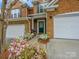 Beautiful brick home featuring a landscaped front yard and inviting entrance at 15643 Canmore St, Charlotte, NC 28277
