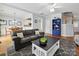 Open-concept living room flowing into the dining area and kitchen at 15643 Canmore St, Charlotte, NC 28277