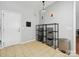 Mud room featuring tile flooring, door to the outside, and wire shelving at 15643 Canmore St, Charlotte, NC 28277