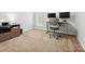 A well-lit home office with a modern desk, comfortable chair, and ample space for productivity at 15643 Canmore St, Charlotte, NC 28277