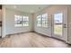 Cozy breakfast nook with wood floors, natural light, and access to the backyard offers a great space to relax and enjoy meals at 1996 Copper Path Dr, Fort Mill, SC 29715