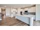 Modern kitchen with white cabinets, stainless steel appliances, an island, and an open layout is perfect for entertaining at 1996 Copper Path Dr, Fort Mill, SC 29715