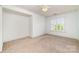 Spacious bedroom with a large window providing ample natural light at 20015 N Cove Rd, Cornelius, NC 28031