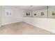 Versatile bonus room with ample natural light, ideal for a playroom or home office at 20015 N Cove Rd, Cornelius, NC 28031