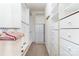 Well-organized walk-in closet with built-in shelving and ample storage space at 20015 N Cove Rd, Cornelius, NC 28031