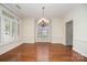 Spacious dining room with hardwood floors, lots of bright natural light, and elegant chandelier at 20015 N Cove Rd, Cornelius, NC 28031