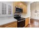 Well-lit kitchen with stainless steel appliances, light countertops, and stylish light fixtures at 20015 N Cove Rd, Cornelius, NC 28031