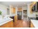 Bright kitchen with stainless steel appliances, wood cabinets, and hardwood flooring for a modern feel at 20015 N Cove Rd, Cornelius, NC 28031