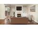 Cozy living room featuring fireplace, built-in shelving, and a serene ambiance at 20015 N Cove Rd, Cornelius, NC 28031