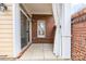 Covered patio with brick wall and large window to let in natural light at 20015 N Cove Rd, Cornelius, NC 28031