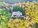 Stunning aerial view capturing a beautiful home surrounded by lush greenery and a private driveway at 210 Dexter Ave, Kannapolis, NC 28081