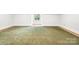 Large basement featuring carpet and a bright window at 210 Dexter Ave, Kannapolis, NC 28081