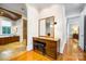Elegant bathroom vanity featuring wood cabinets, a large mirror, and ample storage at 210 Dexter Ave, Kannapolis, NC 28081