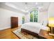 Bright bedroom featuring hardwood floors, large windows, and trey ceilings at 210 Dexter Ave, Kannapolis, NC 28081