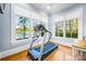 Bright exercise room features a lake view and a modern treadmill at 210 Dexter Ave, Kannapolis, NC 28081