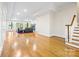 Bright living room with hardwood floors, tray ceiling, lake views and a cozy fireplace at 210 Dexter Ave, Kannapolis, NC 28081