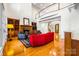 Bright living room with wood floors, a fireplace, and comfortable seating near large windows at 210 Dexter Ave, Kannapolis, NC 28081