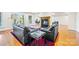 Cozy living room area with modern furniture, a fireplace and hardwood flooring at 210 Dexter Ave, Kannapolis, NC 28081