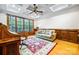 Home office with hardwood floors, wood trim, a large window, and comfortable sofa at 210 Dexter Ave, Kannapolis, NC 28081