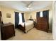 The bedroom has a ceiling fan and a charming vintage desk at 217 Windsor Dr, Shelby, NC 28150