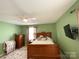 Cozy bedroom with wood furniture and ceiling fan at 217 Windsor Dr, Shelby, NC 28150