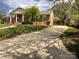 Wide driveway leading to a well-maintained home with a brick facade and a charming front porch at 217 Windsor Dr, Shelby, NC 28150