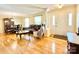Spacious living room with hardwood floors, front door, dining table and living room seating at 217 Windsor Dr, Shelby, NC 28150