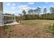 Spacious backyard featuring a patio, seating, outdoor area, mature trees, and lush greenery at 224 Old Harbor Dr, Mount Gilead, NC 27306