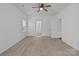 Bright bedroom with neutral carpet, ceiling fan, and ample natural light at 224 Old Harbor Dr, Mount Gilead, NC 27306