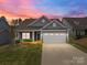 Charming single-Gathering home with a well-manicured lawn and inviting curb appeal, perfect for modern living at 224 Old Harbor Dr, Mount Gilead, NC 27306