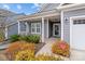 Inviting front entrance featuring a covered porch, well-maintained landscaping, and attractive exterior at 224 Old Harbor Dr, Mount Gilead, NC 27306