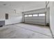Spacious two-car garage featuring bright lighting, a concrete floor, and an automatic door at 224 Old Harbor Dr, Mount Gilead, NC 27306