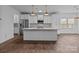 Spacious kitchen featuring a large island with marble countertop and stainless steel appliances at 224 Old Harbor Dr, Mount Gilead, NC 27306