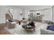 Stylish living room showcases neutral tones, modern furniture, and an open floor plan leading into the kitchen at 224 Old Harbor Dr, Mount Gilead, NC 27306
