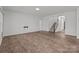 Open-concept living room with vinyl floors, recessed lighting, and easy access to other rooms at 224 Old Harbor Dr, Mount Gilead, NC 27306