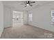 Spacious living area features plush carpet, abundant natural light, and easy access to other rooms at 224 Old Harbor Dr, Mount Gilead, NC 27306