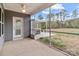 Relaxing screened-in porch with ceiling fan, backyard views, and an outdoor patio area at 224 Old Harbor Dr, Mount Gilead, NC 27306