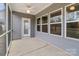 Cozy screened-in porch with ceiling fan and a door, perfect for enjoying outdoor living at 224 Old Harbor Dr, Mount Gilead, NC 27306
