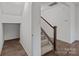 Carpeted staircase with wooden banister and trim at 224 Old Harbor Dr, Mount Gilead, NC 27306