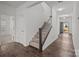 Carpeted stairs with white railing and dark wood accents lead to the upper level at 224 Old Harbor Dr, Mount Gilead, NC 27306