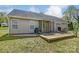 Relaxing backyard features a wooden deck, grill, and outdoor seating for entertaining or enjoying the outdoors at 239 Bradford Glyn Dr, Mooresville, NC 28115
