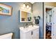 Modern bathroom features updated vanity, sink, and decorative accents for a stylish look at 239 Bradford Glyn Dr, Mooresville, NC 28115